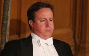 ameron looking uncomfortable at a dinner. Source: Independent